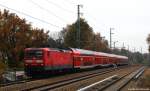 Mit dem RE1 nach Frankfurt (Oder) fuhr 112 148-2 am 9.11.14 durch Berlin-Nikolassee.