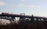 Unbekannte 112 mit RE7/SH-Express nach Flensburg auf der Rendsburger Hochbrcke. 08.03.2015(865)