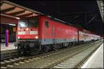 Mit einer S-Bahn nach Warnemnde steht die 112 111 am 22.02.2002 im Rostocker Hauptbahnhof.