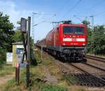 112 140-9 fhrt am 20.7.10 mit dem N-Wagenpark des RE´s 21017 nach Hamburg Hbf. am B Kreyhorn nahe der Ortschaft Tornesch vorbei.
