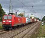 145 003-0 fhrt am 18.9.10 mit einem bunten Containerzug durch den Bhf. Tostedt.