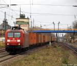 Mit einem bunten Containerzug fhrt 145 042-8 am 12.11.10 durch den Ort Tostedt.