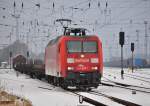 Mit dem Schadwagenzug nach Eberswalde verlsst die 145 007 am 14.12.2012 den Bahnhof Rostock-Seehafen.