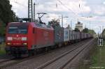 145 053-5 poltert am 4.9.10 mit einem Containerzug durch den Ortsbahnhof Tostedt auf dem Weg nach Bremen.