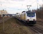 ME 146-12 schiebt am 12.2.11 den ME nach Hamburg Hbf. aus dem Tostedter Bahnhof heraus.