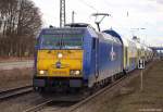 146 521-0 fhrt am 12.2.11 mit  Moin Moin , grendem Tf und dem MEr nach Bremen Hbf. in den Bhf. Tostedt ein.