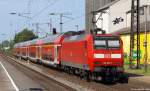 146 021-1 schiebt am 4.6.11 den RE 6 nach Dsseldorf Hbf. aus dem Bhf. Kamen heraus.