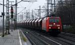 152 117-8 rollte bei typischem Nordwetter mit einem Tanoos Ganzzug durch Harburg. 07.01.11