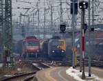 Fernaufnahme in Neumnster...155 219-9 stand dort abgestellt und EG 3112 kam mit einem Mischer dort durchgefahren. 26.2.11