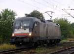 MRCE/TXL 6 182 529-8 auf dem Rückweg von Padborg nach Hamburg festgehalten am Bü Karpfenteich in Schleswig. 14.09.2014