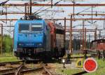 Geschoben von MY 1122 wird die TXL 185 513-9 in den  deutschen  Bereich im Pbf Padborg. 02.07.2013
