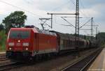 185 335-4 poltert am 23.7.10 mit einem gemischten Gterzug durch den Schleswiger Bahnhof gen Sden.