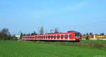 423 035/535 und 423 038/538 fuhren am 29.3.14 als S11 nach Bergisch Gladbach bei Neuss-Allerheiligen durch die Felder.