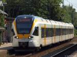 ET 7.04 der eurobahn rollt am 4.6.11 als RE 3 nach Dsseldorf Hbf. in den Bhf. Kamen ein.