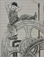 Etwas ratlos sitzt Charlie Chaplin vor der Technik...Eine Filmszene aus Moderns Times 1936.