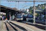 Die MOB Ge 4/4 8004 wartet in Montreux mit dem GoldenPass Express GPX 4068 nach Interlaken Ost die Abfahrt, daneben seht der MOB Be 4/4 9202 mit einem GoldenPass Classic nach Zweisimmen.