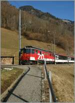 zb De 4/6 110 021-3 mit einem IR Luzern - Interlaken bei der Haltestelle Eblingen am 5. Februar 2011.