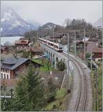 Bei Ringgenberg auf dem herrlichen Viadukt mitten im Ort ist ein Zentralbahn IR auf dem Weg von Interlaken Ost nach Luzern. 

16. M�rz 2021