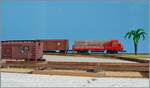 Während im Hintergrund die U36B 'Santa Fe' ATSF 353 Diesellok zu sehne ist, zeigt sich im Vordergrund er im Bau befindliche Güterschuppen bez. die Güterampe dazu. Schuppen und Güterrampe werden nur Angeschnitten (Halbrelief) zu se ...